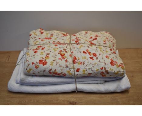 Three vintage bedspreads or quilts, including a cream yellow cotton example, having bevelled corners and one end, in a bright