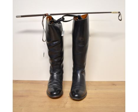 Two pairs of vintage leather riding boots and a riding whip. A pair of Regents Made in England black leather riding boots, si