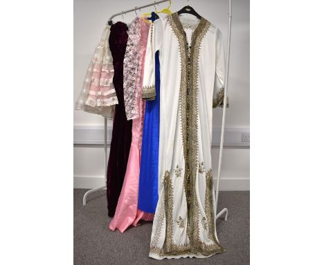 A collection of vintage womenswear, comprising 1970-80s party dresses, including homemade examples, along with with two petti