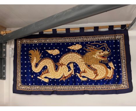 A highly ornate beaded banner or wall hanging, on blue silk and velvet, featuring an extravagant Chinese pearl dragon motif i