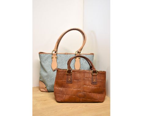 Two vintage Mulberry handbags. A Mulberry baguette bag with cross-body detachable strap, showcasing the brand's signature Con