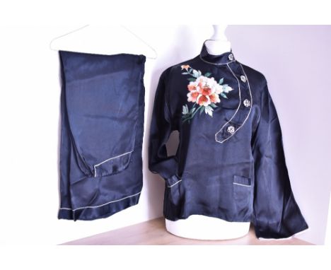 A set of vintage pyjamas in black satin with Chinese inspired 'oriental' details, such as a Mandarin collar and a large embro