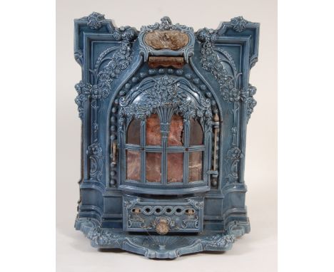 A circa 1900 French cast iron and enamel stove by Lent-Moyen-Vif, the whole cast with flowerheads and trailing foliage flanki