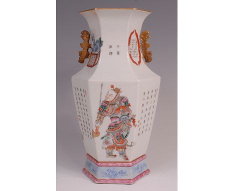 A Chinese porcelain hexagonal vase, enamel decorated in the famille rose palette with a seated figure, a scholar and warrior,