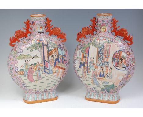 A pair of early 20th century Chinese stoneware moonflasks, enamel decorated in bright colours depicting figure scenes within 