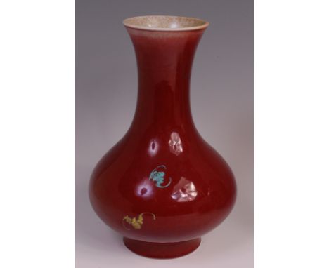 A 19th century Chinese sang de boeuf bottle vase, enamel decorated with blossoming flowers (restored to rim), h.32cm Conditio