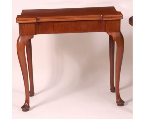 A George III mahogany card table, the shaped fold-over top with proud corners opening to reveal baize lined playing surface w