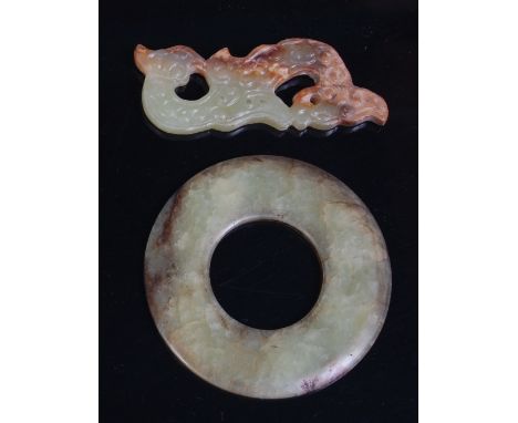 A 19th century Chinese carved, pierced and polished russet jade plaque, as a seated kylin, 7cm; together with a polished russ