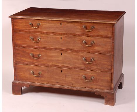 An early George III mahogany squarefront chest, having four long graduated drawers with original brass swan-neck handles and 