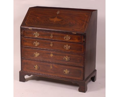 A George III mahogany satinwood crossbanded and inlaid bureau, the hinged fall revealing fitted interior with four long gradu