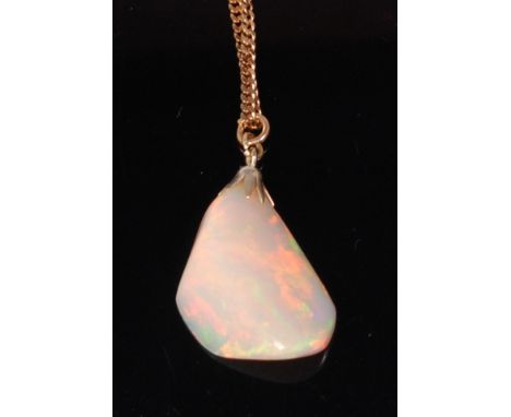 A heavy polished opal pendant on 14ct gold flatlink neck chain, the 18.5ct opal reputedly from Ethiopia's Welo Mine, gross we