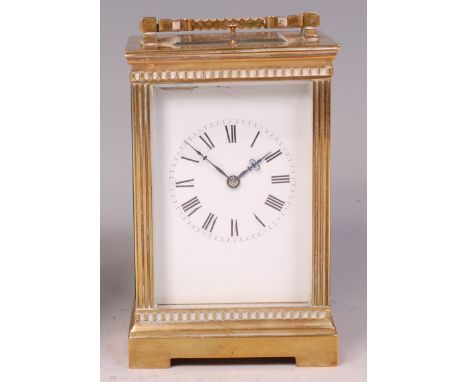A late 19th century French lacquered brass carriage clock, having push button hour and half-hour repeat, white enamel dial wi