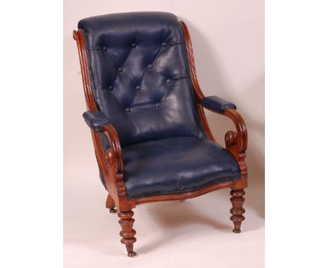 An early Victorian mahogany framed scroll back armchair, the whole later upholstered in a cobalt blue rexine, and raised on r