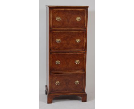 A walnut and figured walnut chest, of four long deep drawers, each with feather banding and raised on bracket feet, h.160cm, 