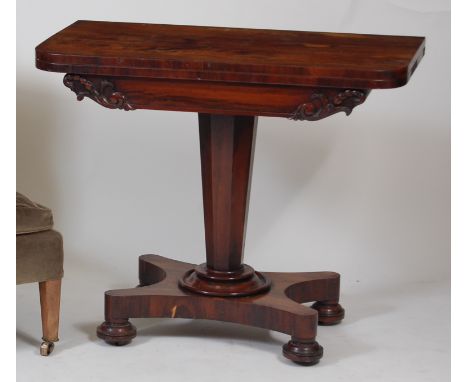 A William IV rosewood pedestal card table, having a D-shaped fold-over top with swivel action, the whole raised upon a quatra