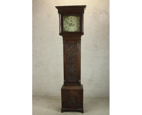 A late 18th/early 19th century carved oak longcase clock, the white painted enamel dial with  black painted Arabic numerals, 