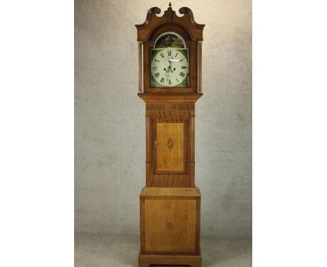 A late 18th century J. M. Tomney of Newcastle mahogany and walnut cased longcase clock, with broken swan neck pediment, the d