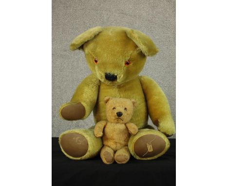 An early 20th century Merrythought brown articulated limb teddy bear together with a Chiltern brown articulated limb teddy be