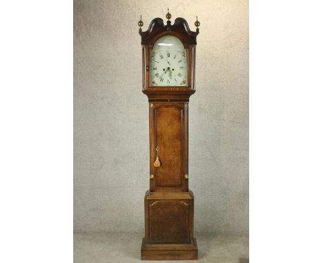 A 19th century oak cased longcase clock, with broken swan neck pediment and three brass finials clock, the painted dial decor