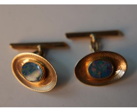 A pair of leather cased Art Deco 9ct rose gold black opal doublet set engine decorated chain link cufflinks. Stamped 9ct, Bri