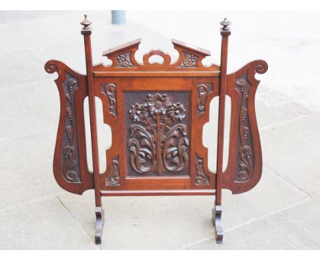 A carved mahogany fire screen circa 1900. L79cm.