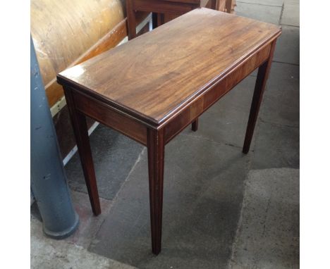 A Georgian mahogany tea table. Min. L92cm D44cm H75cm.