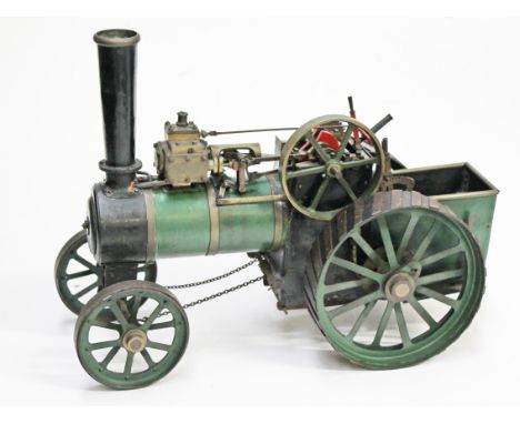 A scratch built live steam single cylinder agricultural tractor engine painted in green, length 37cm.