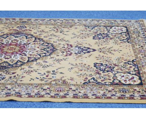 MACHINE MADE EASTERN BORDER CARPET, with large centre medallion with pendants on a gold and floral ground, 9' x 6'3" 