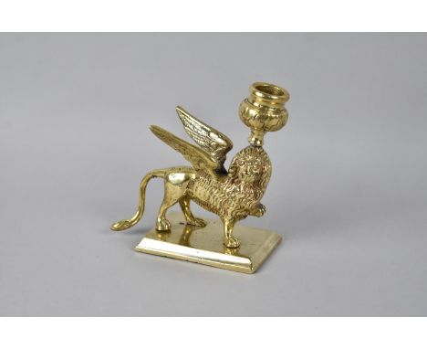 A 19th Century Heavy Brass Candlestick in the form of the Winged Lion of St. Mark in Venice, 13.5cms High 