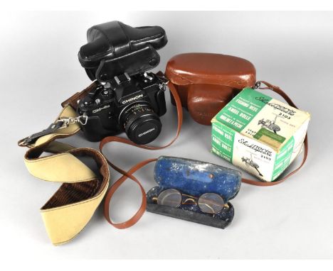 A Vintage Leather Cased Yashica 35mm Camera, A Chinon CN-4s 35mm Camera and a Shakespeare Open Face Spinning Fishing Reel 