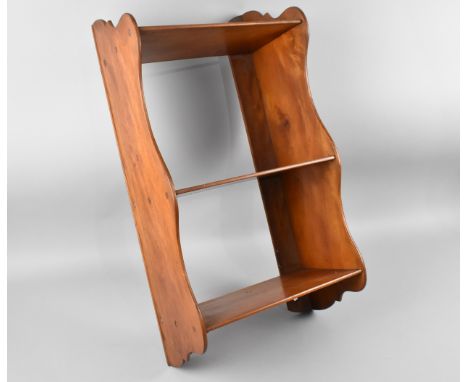 An Edwardian Wall Hanging Three Shelf Unit, 58cm high and 31cm wide 