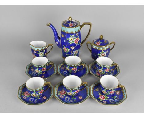 A Noritake Coffee Set Hand Painted with Flowers on Blue Ground to Comprise Coffee Pot, Six Coffee Cans, Six Saucers, Milk Jug