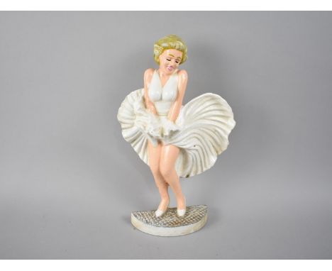 A Reproduction Cold Painted Cast Iron Door Stop in the Form Of Marilyn Monroe, 35cm high 