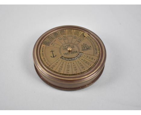 A Circular Reproduction Brass Compass, the Screw off Lid with One Hundred Year Calendar, from 1957-2056, 7.5cm Diameter 