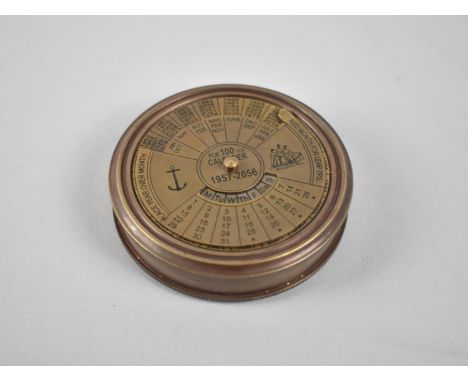 A Circular Reproduction Brass Compass, the Screw off Lid with One Hundred Year Calendar, from 1957-2056, 7.5cm Diameter 