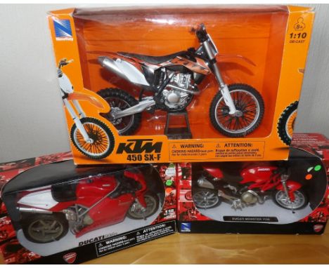 Three New Ray motorbike models, two Ducati and one KTM motorcross example P&amp;P group 2 (£20 for the first item and £2.50 f