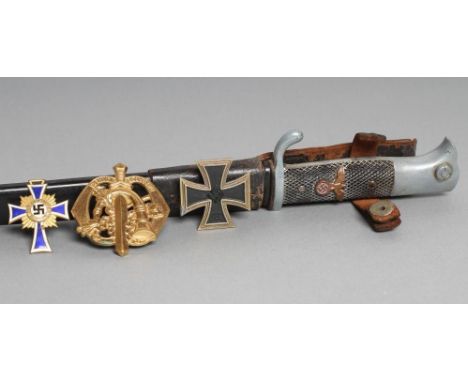 A THIRD REICH DRESS BAYONET, with 9 3/4" blade, reichsadler applied to the grip, metal scabbard and leather frog, 15 7/8" lon