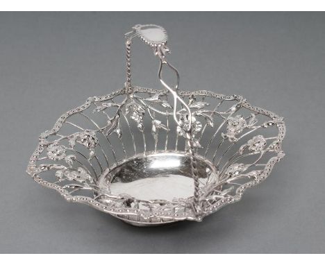 A GEORGE III SILVER WIREWORK SWEETMEAT BASKET, no maker's mark, London 1767, of shaped oval form, the rope twist and wire spe