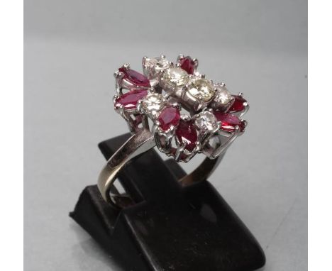 A RUBY AND DIAMOND CLUSTER RING, the seven marquise cut rubies asymmetrically claw set around seven brilliant cut diamonds to