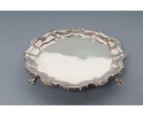 A VICTORIAN SILVER WAITER, maker Thomas Hughes Headland, London 1852, of shaped circular form, the pie-crust rim with escallo