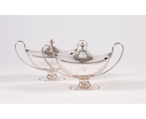 A PAIR OF GEORGE III SILVER SAUCE TUREENS AND COVERS, maker John Robins, London 1787, of navette form with reeded high loop h