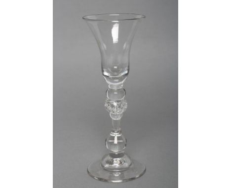 A LIGHT BALUSTER WINE GLASS, c.1745/50, the flared bell bowl with solid base on cushion and ball knops, beaded acorn knop on 