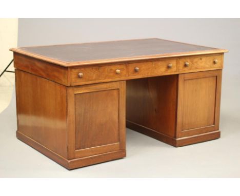 A VICTORIAN MAHOGANY LARGE PARTNERS DESK, the moulded edge and banded top inset with brown tooled leather, three frieze drawe