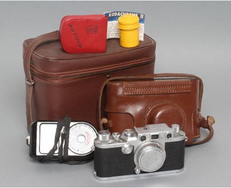 A LEICA CAMERA, 1950's, Leitz Elmar F=5cm 1:35 lens with original cover, numbered 519948, Germany, with original stitched lea