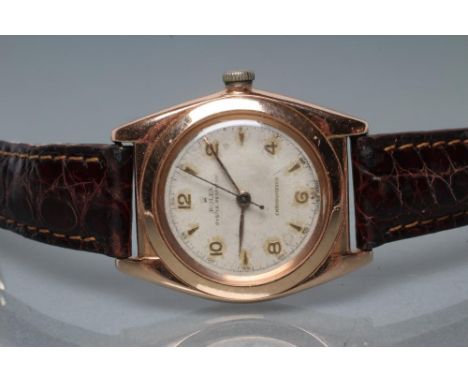 A GENTLEMAN'S GOLD BUBBLE BACK ROLEX OYSTER PERPETUAL CHRONOMETER, the pale champagne dial with applied gilt metal Arabic num