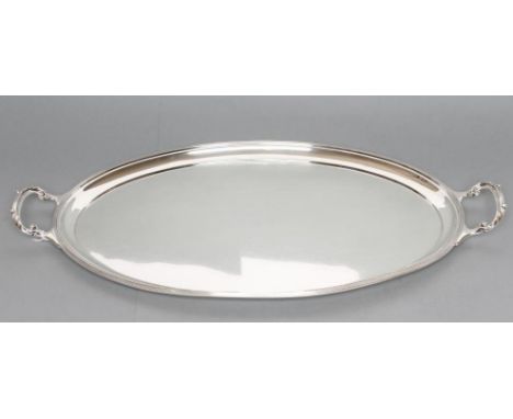 AN OVAL SILVER TRAY, maker Mappin & Webb, Sheffield 1951, with applied reeded rim and two acanthus sheathed handles, 24" wide