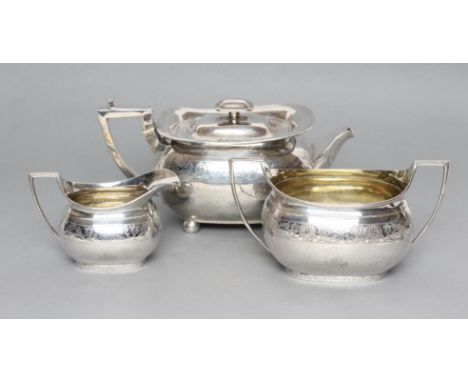 A LATE GEORGE III SILVER MATCHED THREE PIECE TEA SERVICE, maker Emes & Barnard, London 1808 (teapot) and maker Robert Emes, L