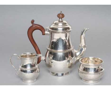 A SILVER THREE PIECE BACHELOR'S TEA SERVICE, maker Goldsmiths & Silversmiths Co., London 1930 and 1931 (milk jug), of single 