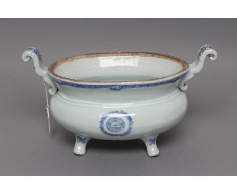 A CHINESE PORCELAIN TUREEN of squat oval form with two scroll lug handles, raised upon four out turned feet, painted in under