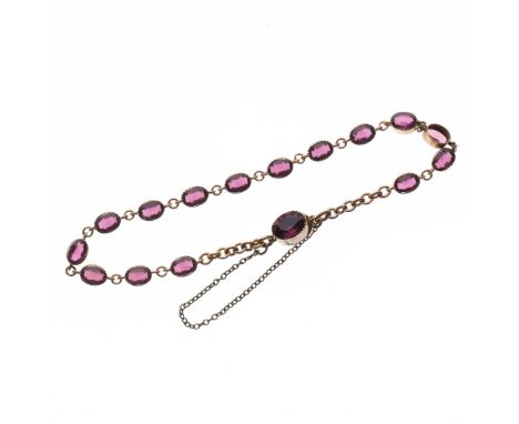 Gold Amethyst tennis style bracelet. Measures approx. 19.5cm. Has been tested as 9ct gold. Signs of age and wear as expected,